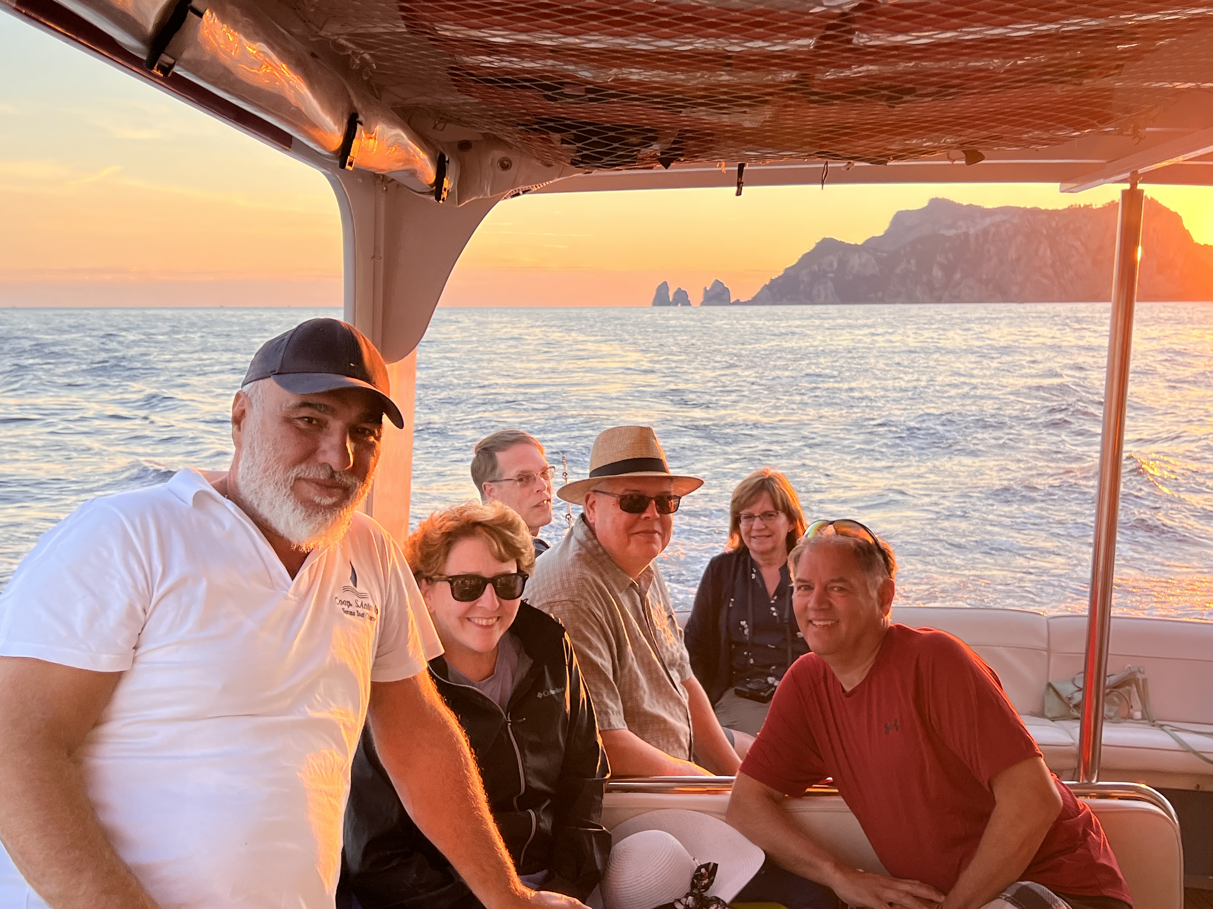 Group boat tour at sunset in Italy