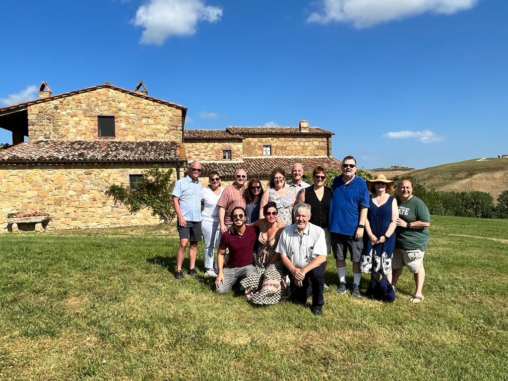 Group gathering at an outdoor Italian villa
