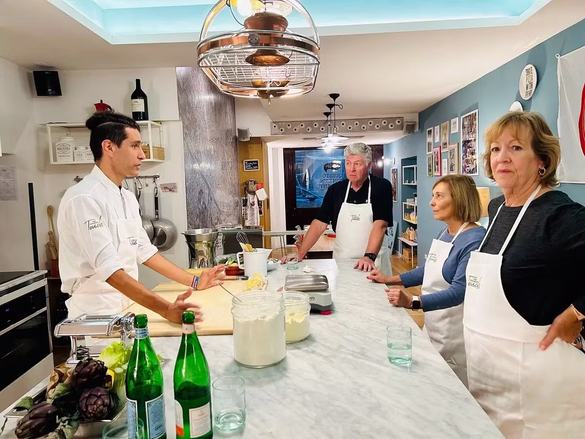 Group joining a hands-on cooking class in Italy