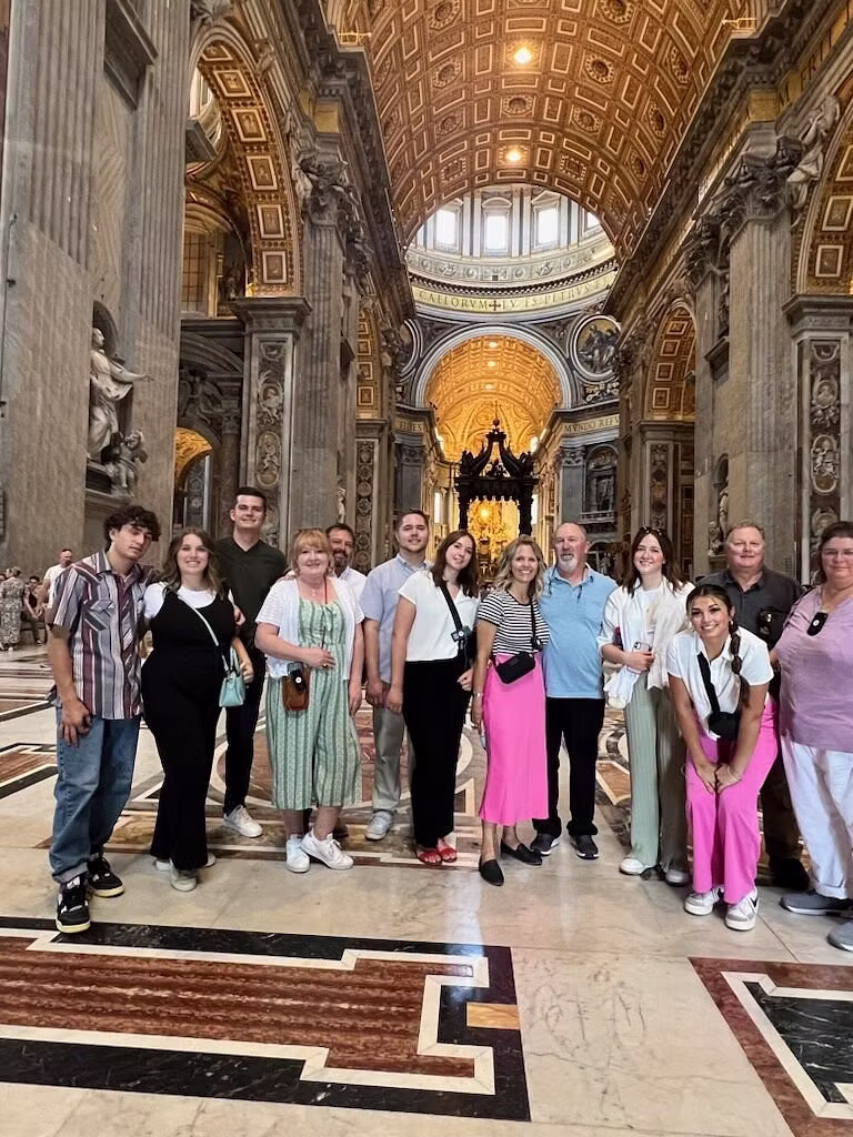 Group visit inside a grand basilica in Rome