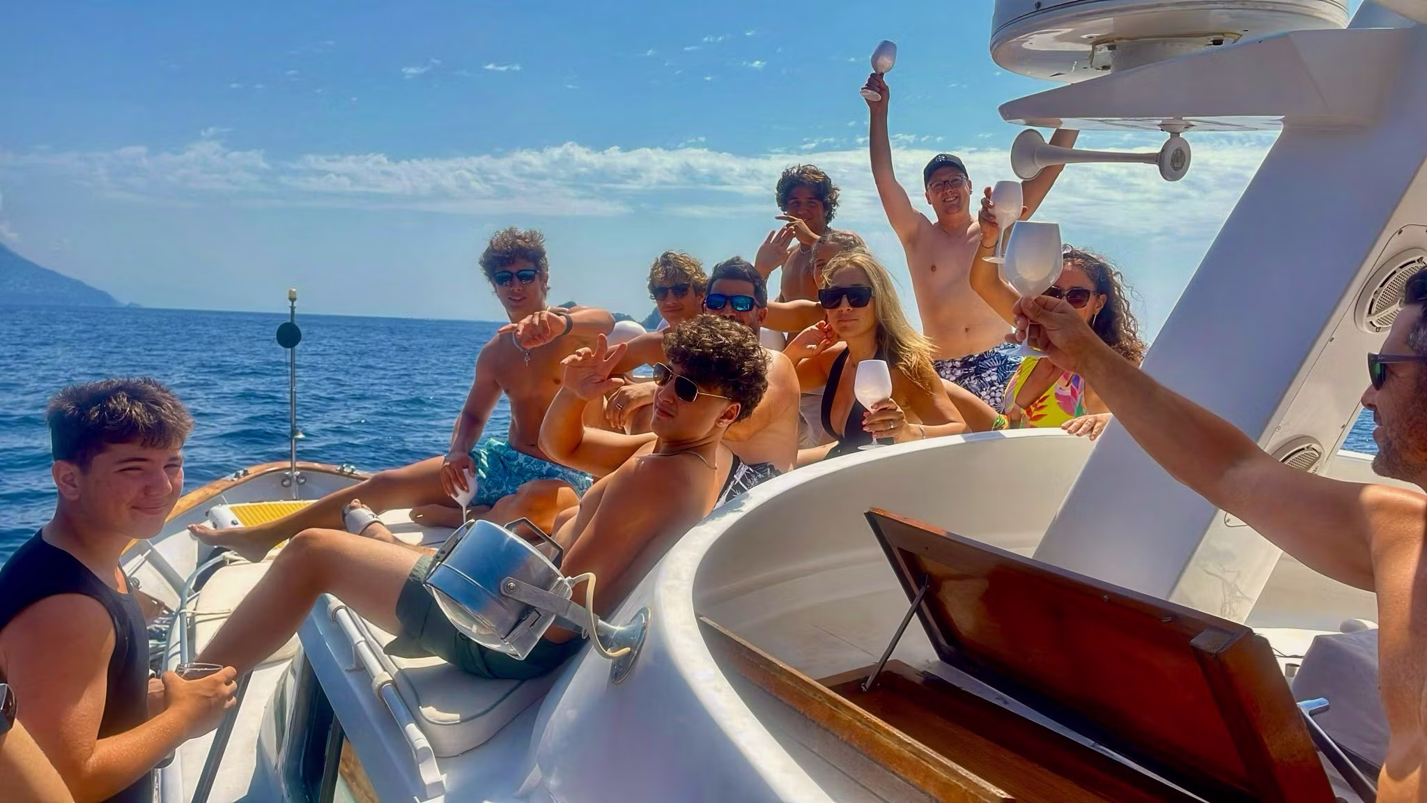 Amalfi Coast boat experience with swimming stops and cliffside villages