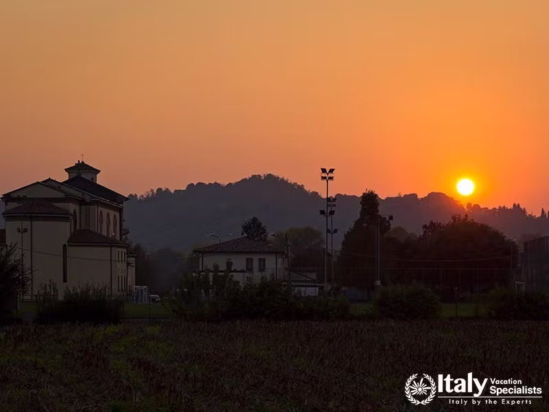 Summer evening in the village, was seen in Vicenza, Italy. Sunset in the late evening with a church 