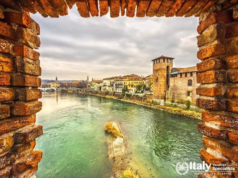 Scenery with Adige River and Ponte Scaligero and Castelvecchio, Verona, Italy. 