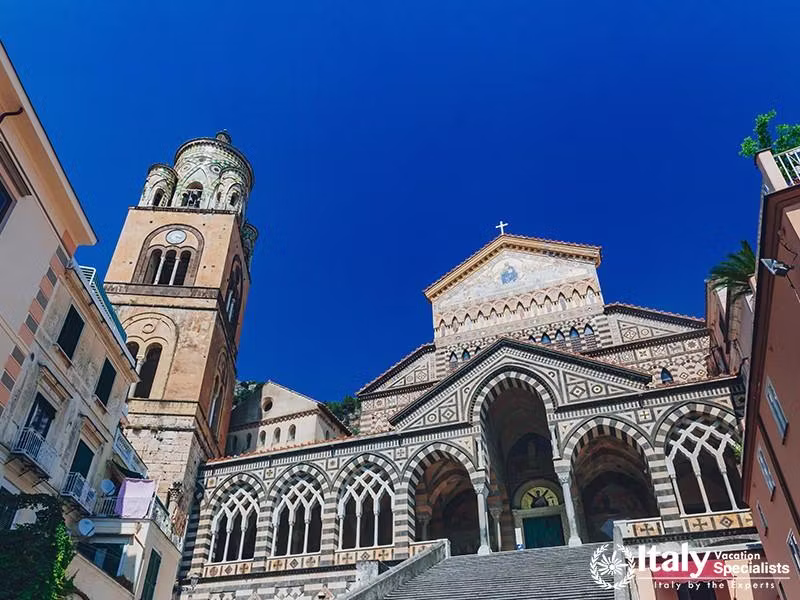 Frontal view of the Amalfi Cathedral and bell tower in the town of Amalfi, Italy