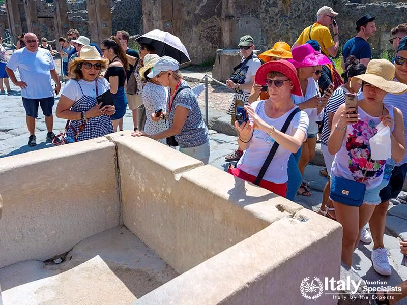 June 3, 2018 Tourist look remains of a public drinking water fountain within the ruins of the ancien