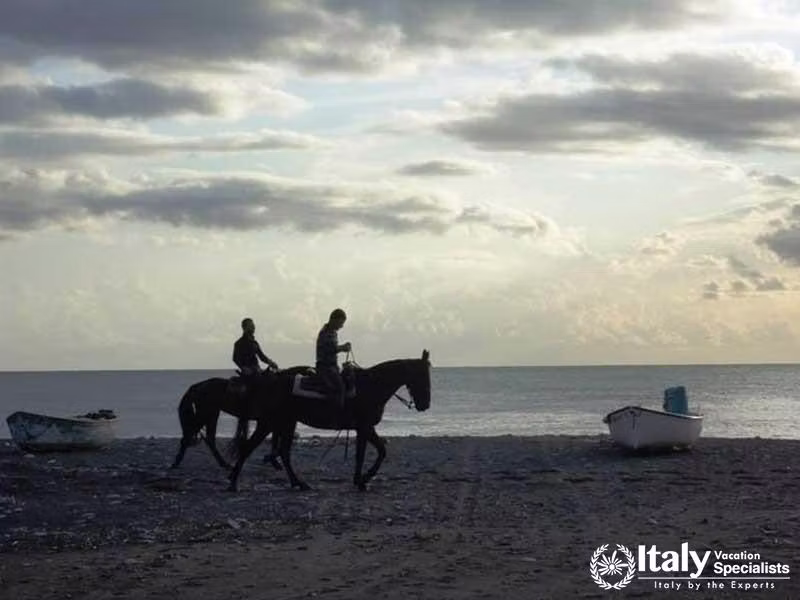 Tortora-at-Sunset,-Beach-side-Horseback-Ride