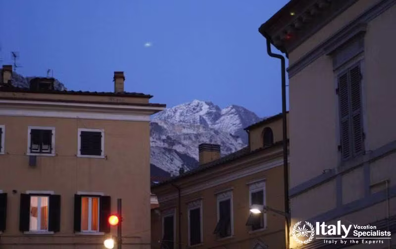 Carrara, Italy - Town by Night with Moon 