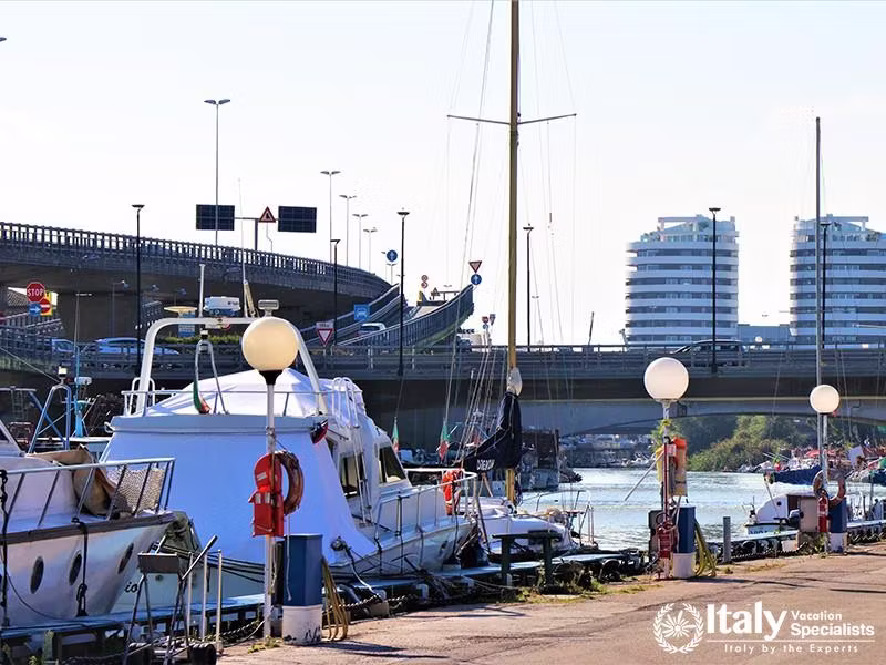 Pescara, Italy - October 2018. View of the Pescara river, with fishing boats. In the background the 