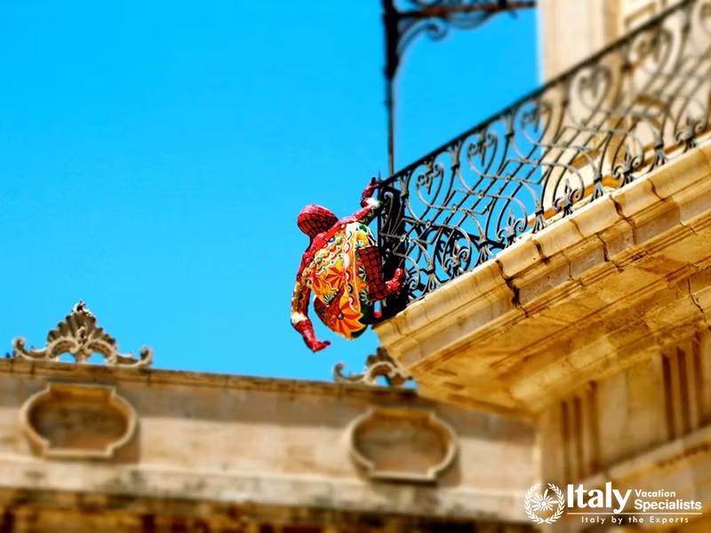 Spider-Man climbing a building in Siracusa, Sicily Italy