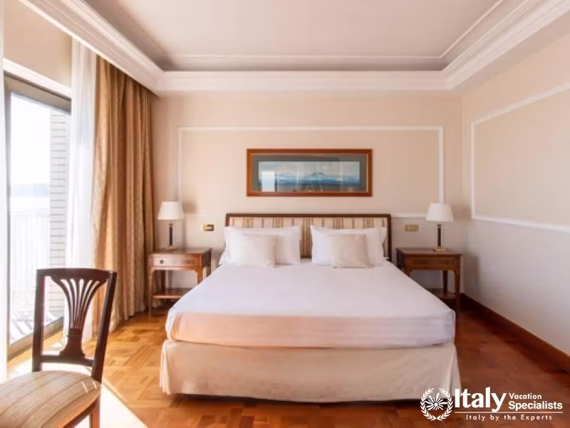 A bright and classic room featuring elegant furniture and sea views.