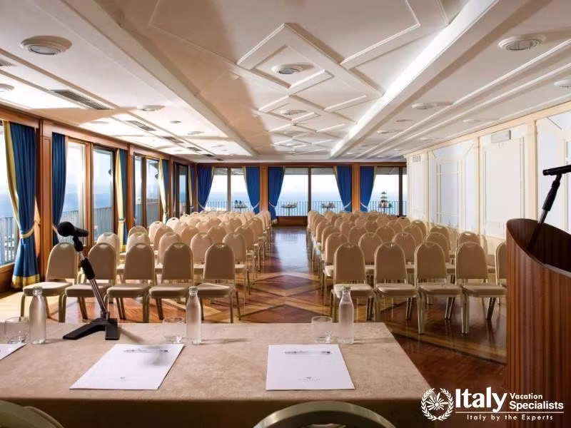 A large conference room with sea views, set up for a seminar.