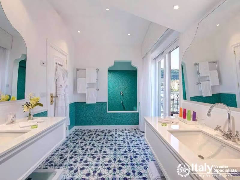 Bright, elegant bathroom with Mediterranean-inspired tiles.