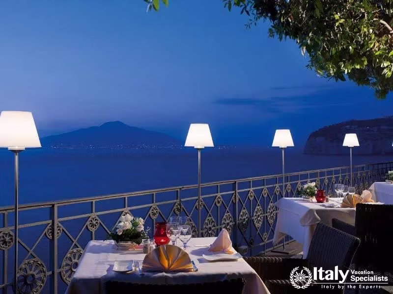 Romantic evening dining with views of the Gulf of Naples.