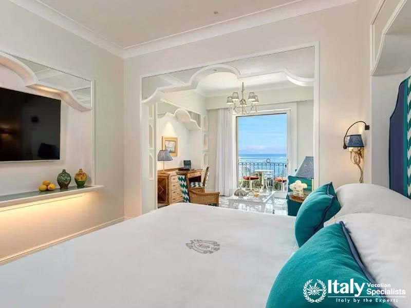 Luxurious bedroom with a sea-view balcony.