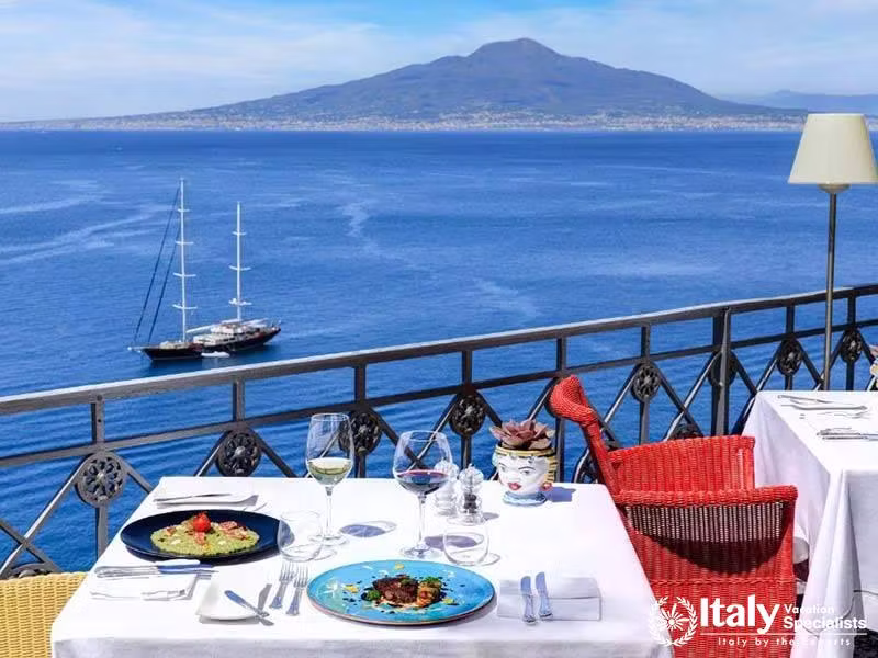 Scenic dining with breathtaking views of the Gulf and Vesuvius.