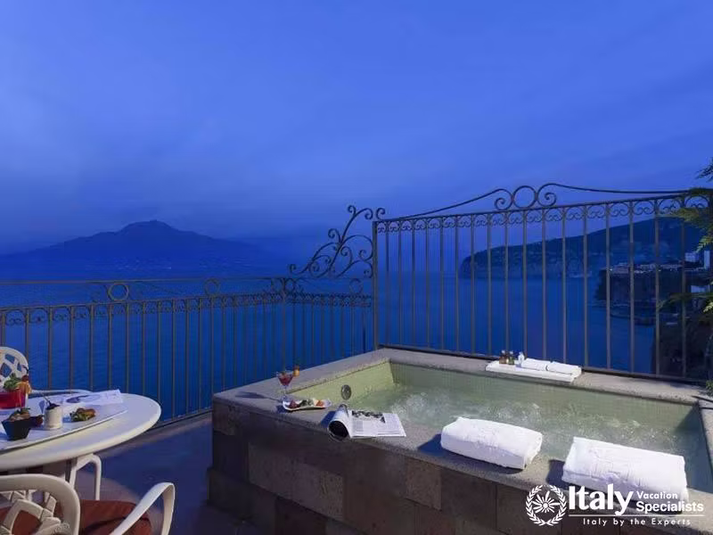 Cozy jacuzzi with panoramic ocean views for ultimate relaxation.