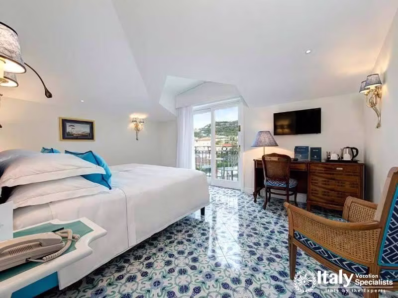 Inviting room with charming decor and private balcony.