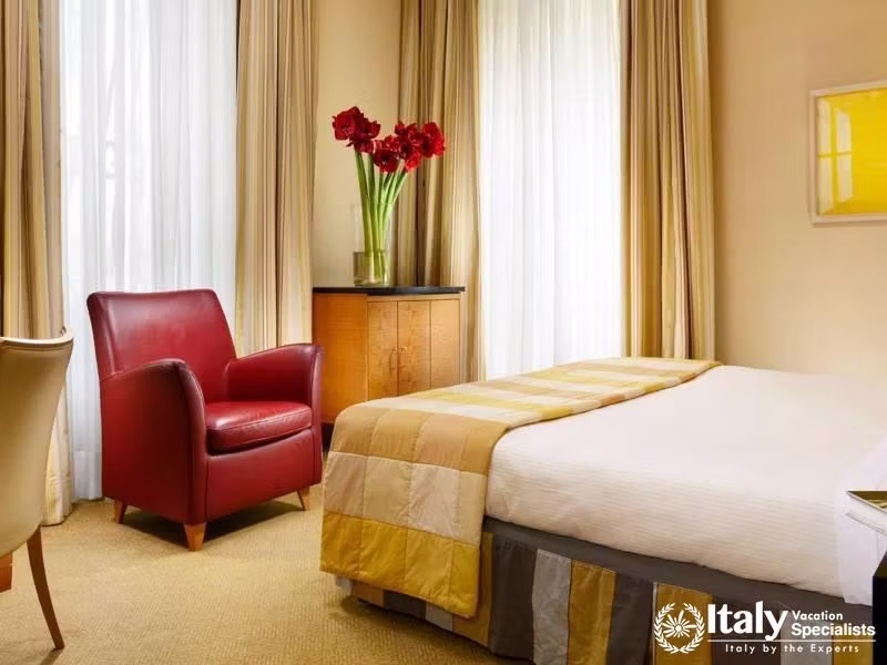 A chic guest room that combines comfort with a touch of luxury at Hotel Capo dAfrica.