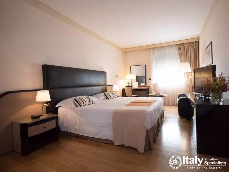 A bright and modern bedroom with sleek design elements, offering a serene retreat.