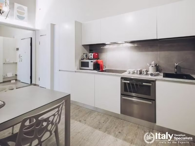 Cook with ease in our modern, fully equipped kitchen with sleek appliances and ample space.