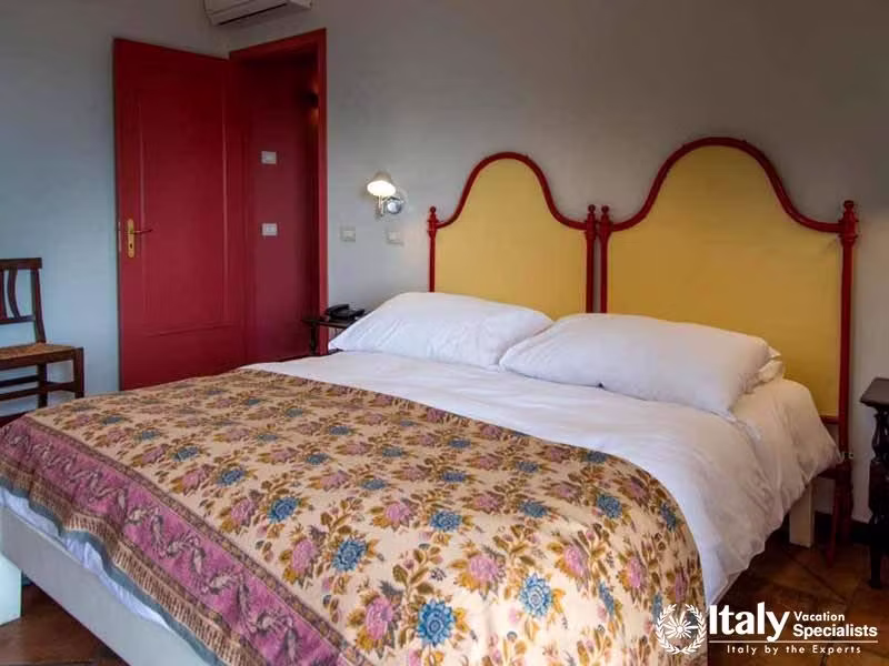 Timeless Comfort: The Classic Bedroom at Agriturismo Tenuta San Michele