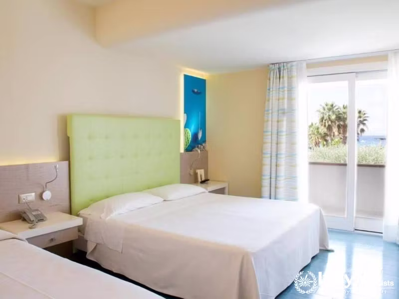 Bright and inviting, this room with a sea view balcony is a serene space at Villaggio Il Gabbiano.