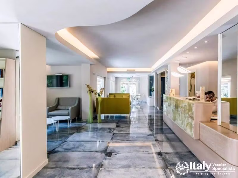 Sleek and welcoming, the reception area at Villaggio Il Gabbiano sets a tone of modern elegance