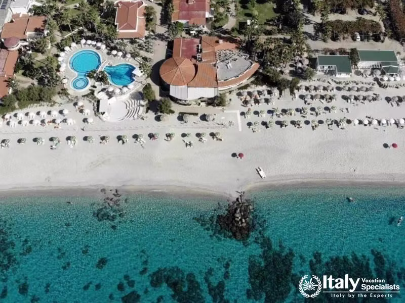 Aerial elegance of Villaggio Il Gabbiano, where the beach meets pristine waters