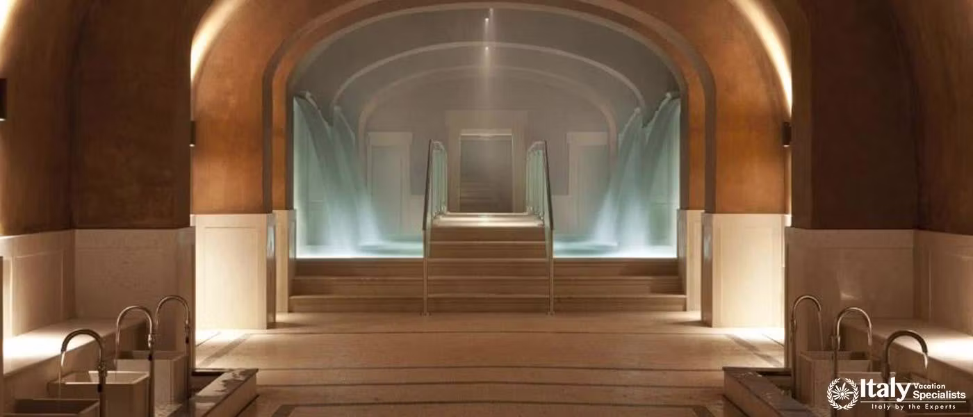 Soothing indoor thermal pools in calming light at QC Termeroma Spa and Resort.