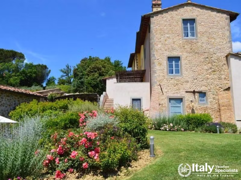 The beautiful exterior of Guardastelle Winery, surrounded by lush gardens and scenic views.