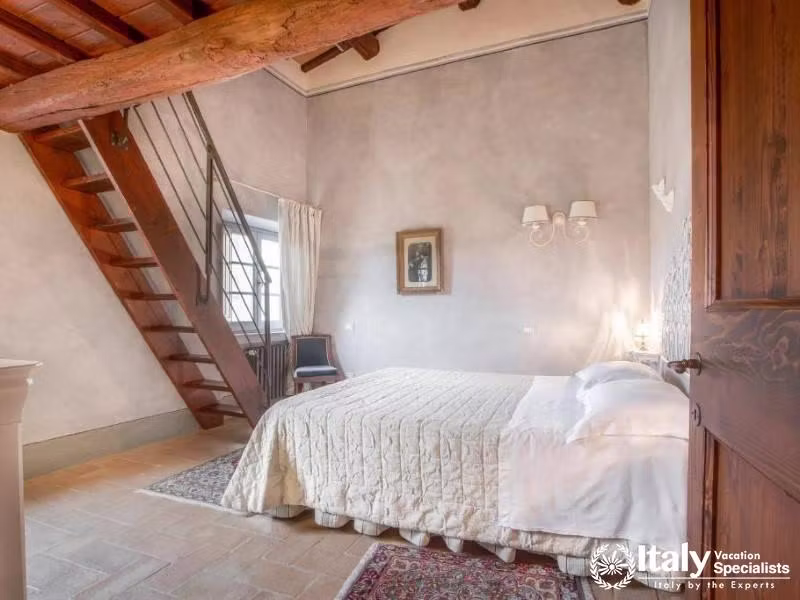 A spacious and inviting bedroom with a loft, perfect for a comfortable and memorable stay .