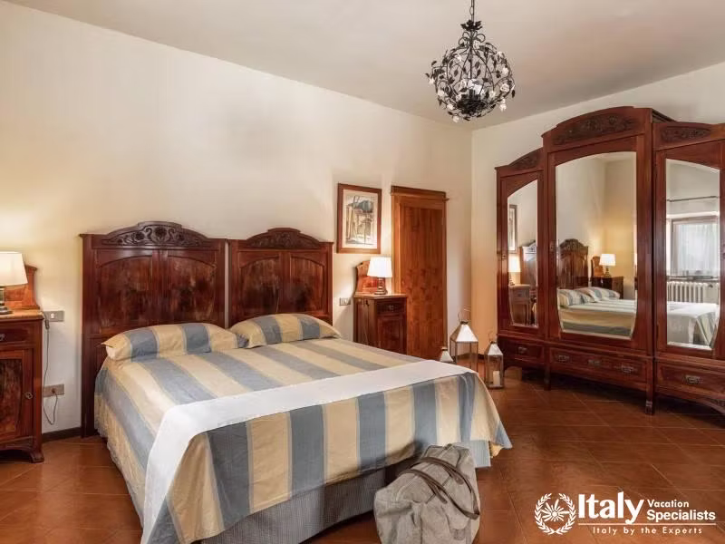 Luxuriate in our elegant master bedroom, complete with classic decor and ample space.