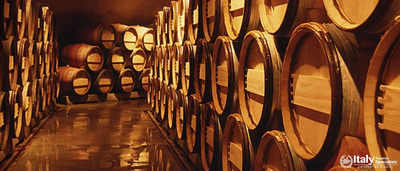 Explore the historic wine cellars, where the rich Vino Nobile di Montepulciano is aged to perfection