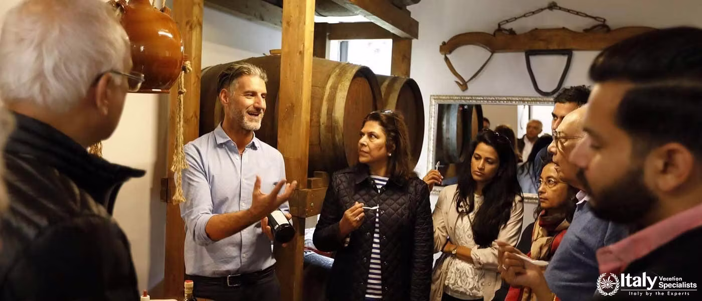 A passionate guide explains the winemaking process to visitors at Sant'Agnese Farm.