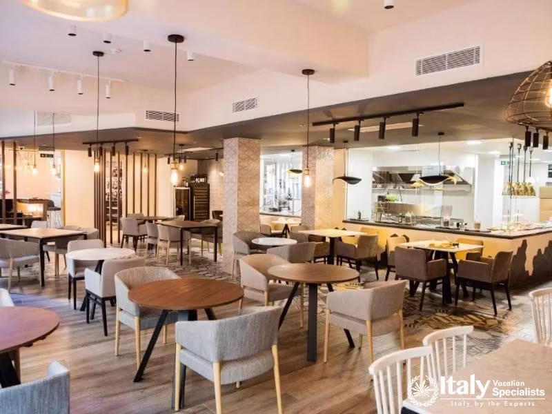 A chic and contemporary restaurant with ample seating and a warm, inviting atmosphere.
