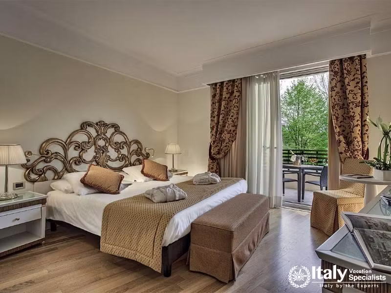 Experience elegance and comfort in our tastefully decorated room with balcony access.