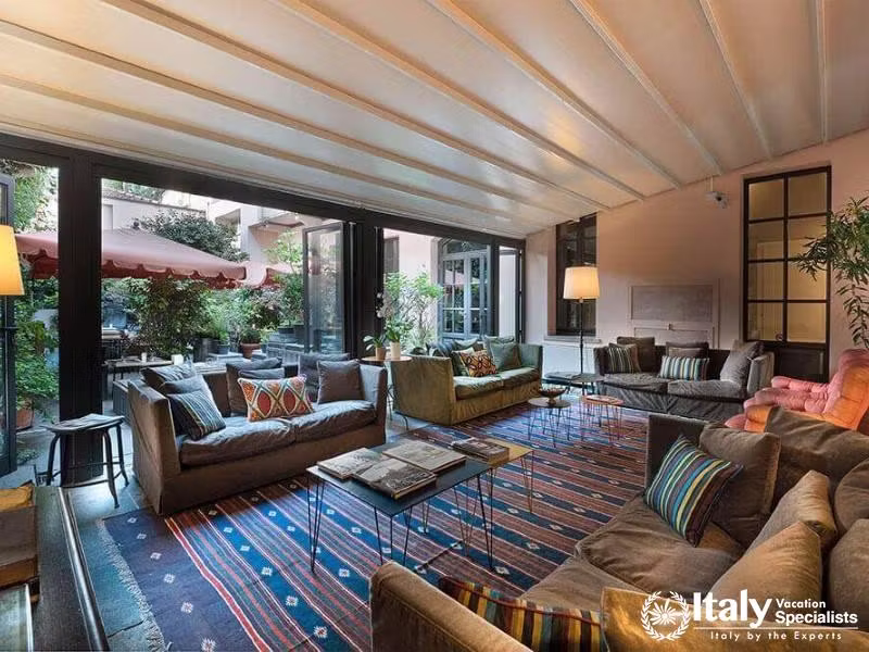 Cozy lobby at Hotel Maison Borella with garden views.