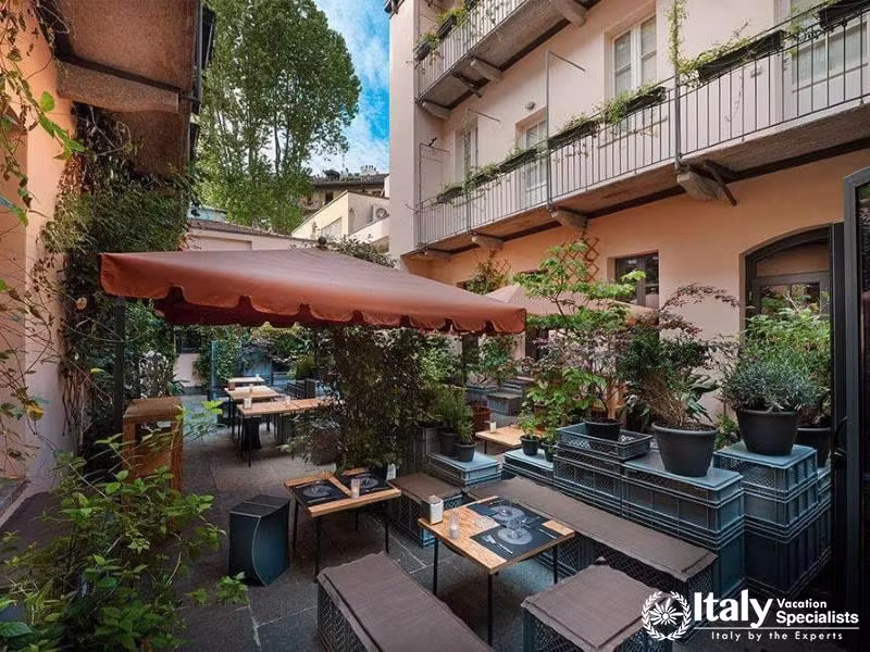 Charming courtyard dining at Hotel Maison Borella.
