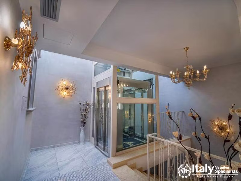Luxurious Staircase and Lift Area at Hotel Colomba D'Oro in Tropea, Italy