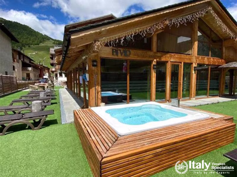 Relaxing Outdoor Hot Tub Area at Bivio Hotel Plaza in Livigno, Italy