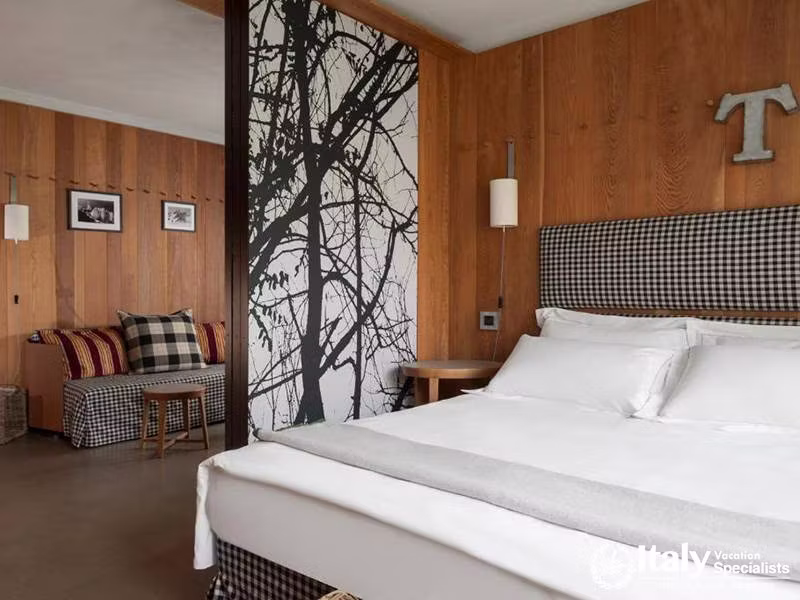 Eden Hotel Bedroom with Wooden Panels and Nature-Themed Divider