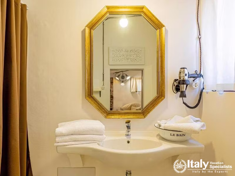 Comfortable Room with Traditional Décor at Albergo Diffuso Mannois