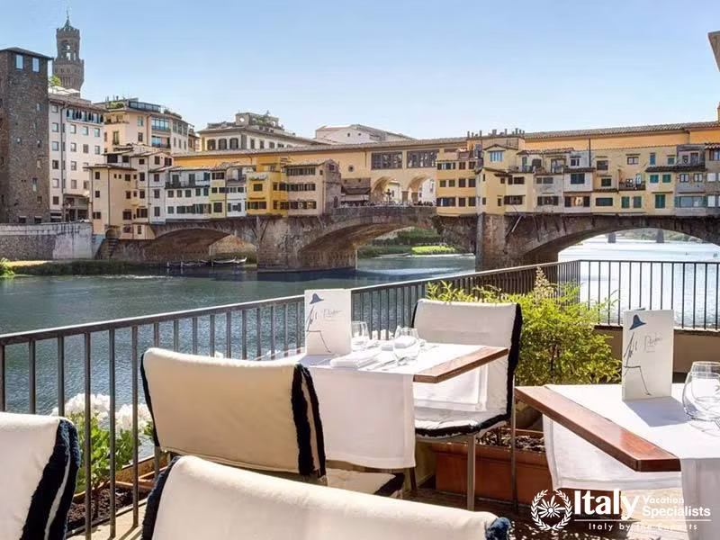 Outdoor Terrace Dining Overlooking Ponte Vecchio at Hotel Lungarno in Florence, Italy