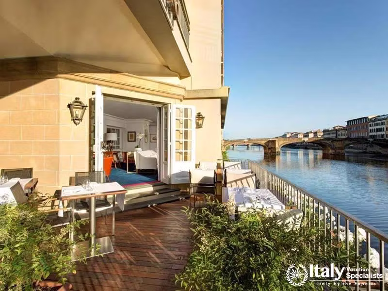 Charming Terrace Overlooking the Arno River at Hotel Lungarno in Florence, Italy