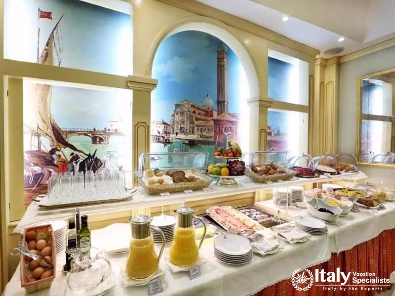 A buffet of flavors under painted Venetian skies awaits guests at Hotel Colombina.