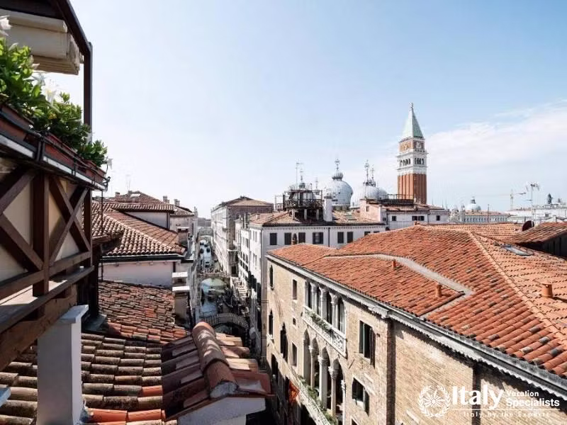 A picturesque view of Veniceâ€™s storied skyline greets you from the terrace at Hotel Colombina.