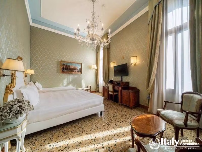 Light dances through the room, offering a blend of luxury and comfort at Hotel Colombina.