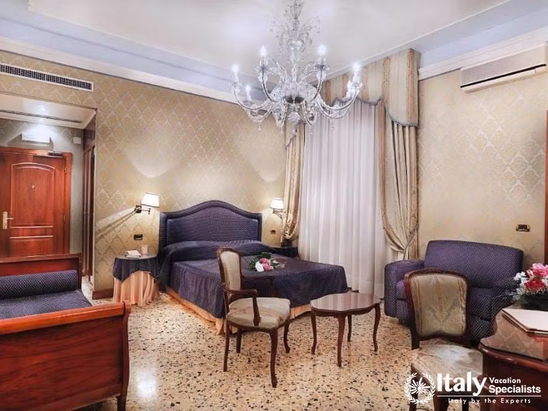Classic Venetian elegance meets modern comfort in the rooms of Hotel Colombina.