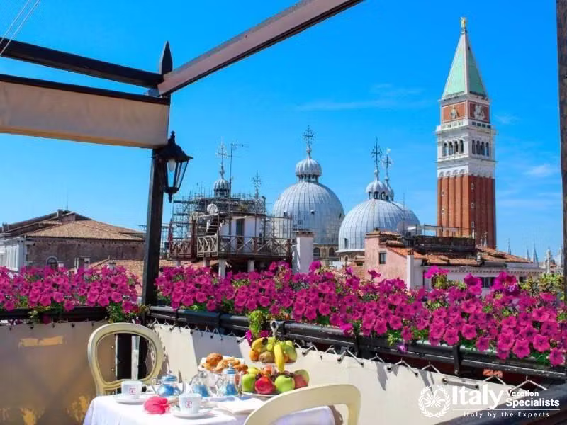 Dine with a view of Venices iconic skyline at Hotel Colombina.