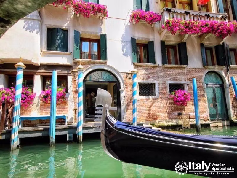 A gondola floats by, enhancing the romantic allure of Hotel Colombina.